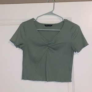 Small, light olive green/sage colored short sleeved top